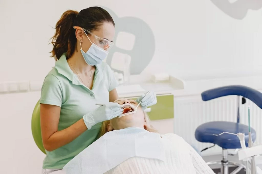 senior-woman-having-dental-treatment-dentist-s-office-woman-is-being-treated-teeth_1157-42152.jpg
