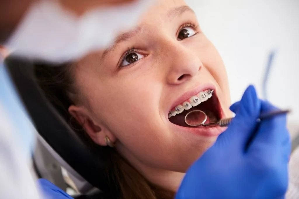 girl-with-braces-during-routine-dental-examination_329181-17710.jpg