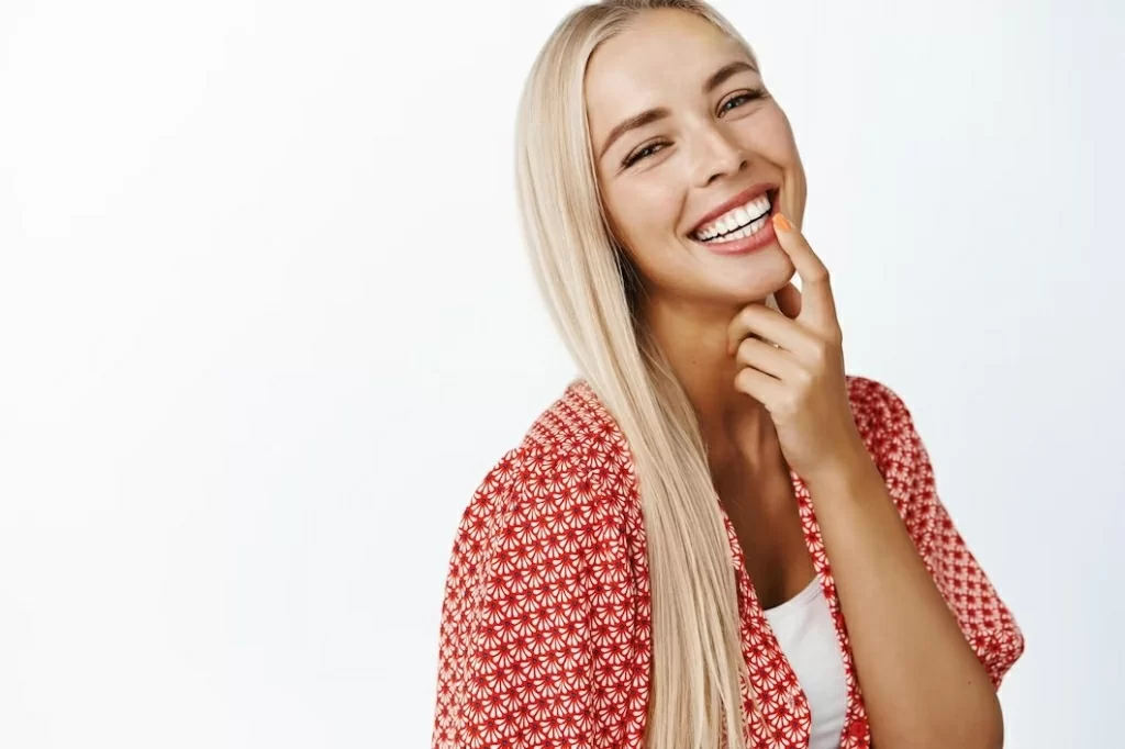 beautiful-blond-girl-with-long-healthy-hair-laughing-smiling-camera-standing-summer-clothes-white.jpg
